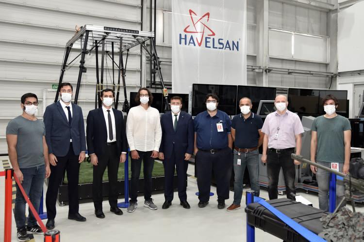 <div>FIVE-ML Projesi'nin tamamlanmasının ardından, HAVELSAN'ın T-129 Atak helikopterinin simülatörü ATAKSİM ve insansız hava aracı Anka Simülatörü, Uzun Menzilli Tanksavar Füze Sistemi (UMTAS) Simülatörü, Hava Savunma Eğitim Merkezi gibi projelerde kullandığı ve Milli Muharip Uçak Projesi Harekat Analizi kapsamında kullanılması planlanan Milli Taktik Çevre Simülasyonu (MTÇS) yazılımının, kural tabanlı davranış altyapısından öğrenen yapay zeka tabanlı davranış altyapısına geçirilmesi hedefleniyor.</div>

<div> </div>

<div> </div>
