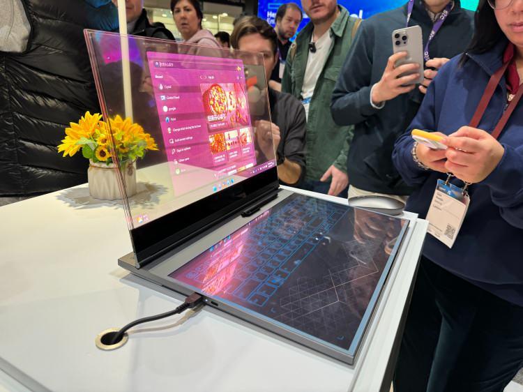 <p><span style="color:#B22222"><strong>LENOVO'NUN DIZÜSTÜ BILGİSAYAR KONSEPTİ</strong></span></p>
<p> </p>
<p>Lenovo'nun şeffaf ekranlı bu dizüstü bilgisayarı, siz çalışırken ekranınızın arkasına bakmaya olanak sağlıyor...</p>