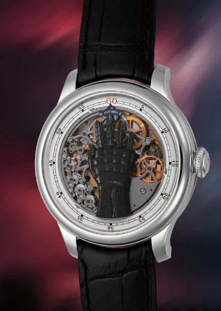 <p><strong>İnsan elini andıran özel mekanizmasıyla dikkat çeken saat, parmakların farklı saatleri gösterecek şekilde hareket ettiği özgün bir tasarımı gözler önüne seriyor.</strong></p>
