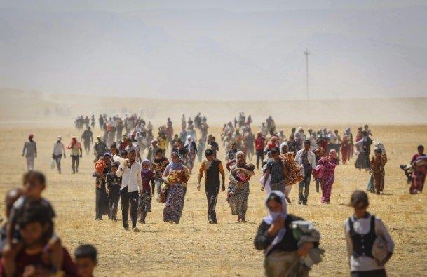 <p>Anadolu Ajansı Gözüyle 2014: Irak'ın Musul kentindeki Sincar Dağı’nda mahsur kalan binlerce Yezidi, karadan oluşturulan güvenlik koridoruyla kurtarıldı. 8.8.2014 (Emrah Yorulmaz - Anadolu Ajansı)</p>
<p> </p>