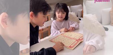 Kur'an &ouml;ğrenmeye &ccedil;alışan minik kızın tatlılığı sosyal medyayı salladı