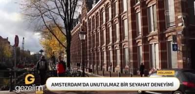 Amsterdam'da bisikletle kanal boyu yolculuk