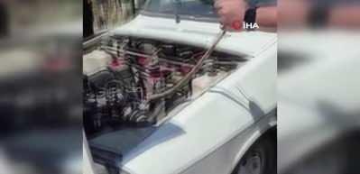 Polatlı’da park halindeki aracın motoruna giren yılanı sopayla çıkardı