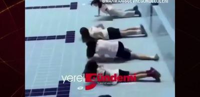Bu g&ouml;r&uuml;nt&uuml;ler sosyal medyayı ayağa kaldırdı! Boş havuzda antrenman yapan sporcuların o anları g&uuml;ndem oldu