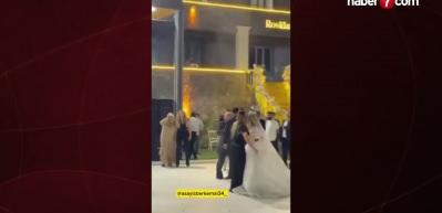 D&uuml;ğ&uuml;n&uuml;n ortasında havaya ateş a&ccedil;an şahsa davetlilerden sert tepki!