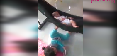 Kardeşini kendi y&ouml;ntemiyle uyutan sevimli kız