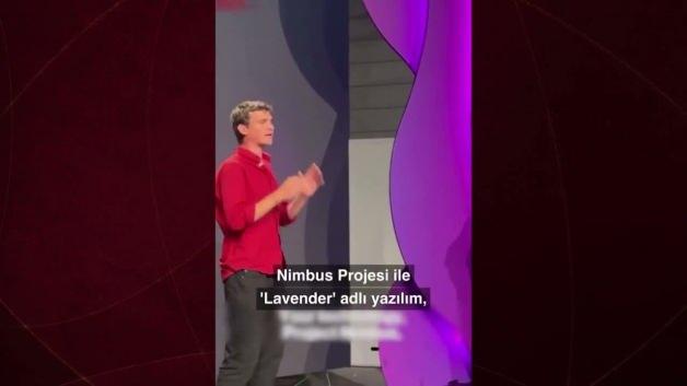 Filistinli aktivist, Londra'da Amazon binası önünde İsrail'e yapay zeka desteği verdiği iddiasıyla protesto yapıyor.
