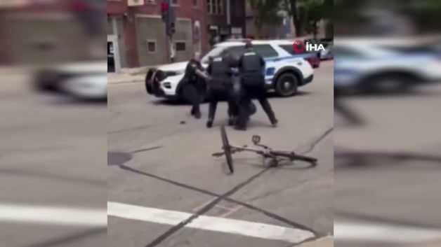 ABD'de polis tarafından başına ateş edilerek öldürülen siyahi şüphelinin ardından Madison'da başlayan protestoları gösteren bir kare.