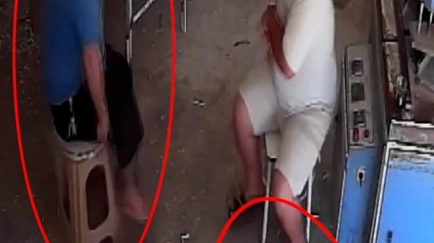 Adana'da iş yerine silahlı saldırı anını gösteren güvenlik kamerası görüntüsünden bir kesit.