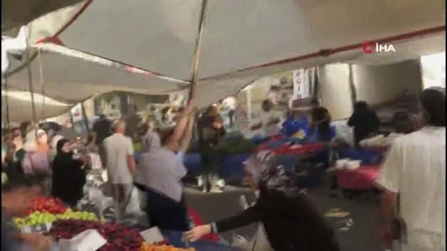 Kuvvetli rüzgar nedeniyle havada süzülen pazar yeri branda direği