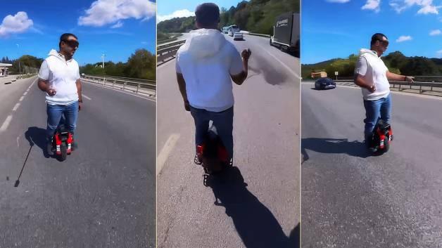 Trafikte akılalmaz anlar: Tek tekerlekli scooter ile tırların sağından ge&ccedil;ti