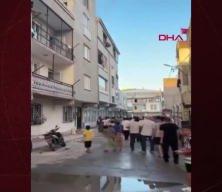 yangından kurtulmak için çocuğuyla birlikte 3'üncü kattan atladı