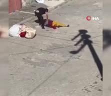 Eşini bayılıncaya kadar sokak ortasında döven şahıs kamerada