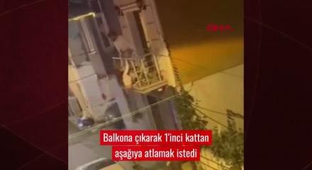 Beyoğlu'nda balkondan d&uuml;şmek &uuml;zere olan eşini son anda yakaladı! İşte nefeslerin kesildiği o anlar