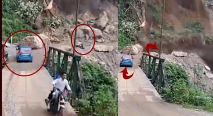 Hindistan'da meydana gelen heyelanda  motosikletlei &ouml;l&uuml;mden kıl payı kurtuldu