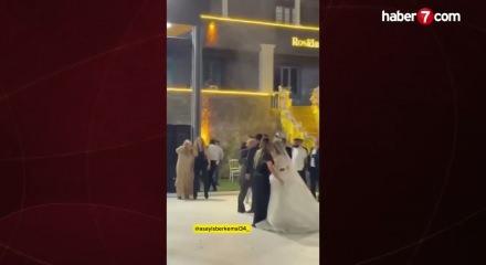 D&uuml;ğ&uuml;n&uuml;n ortasında havaya ateş a&ccedil;an şahsa davetlilerden sert tepki!
