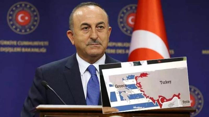 Dışişleri Bakanı Mevlüt Çavuşoğlu, Sevilla haritasını gösteriyor.