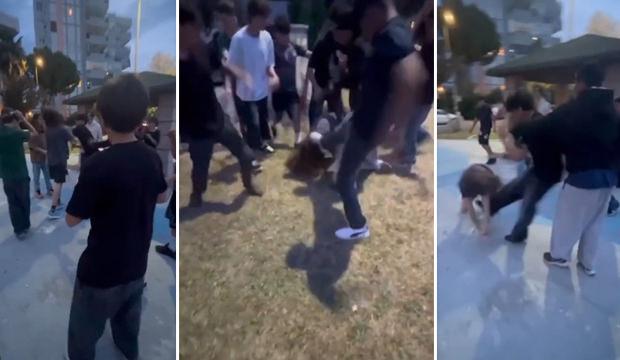 10 &ccedil;ocuk, parkta bir &ccedil;ocuğu tekme ve yumruklarla d&ouml;vd&uuml;