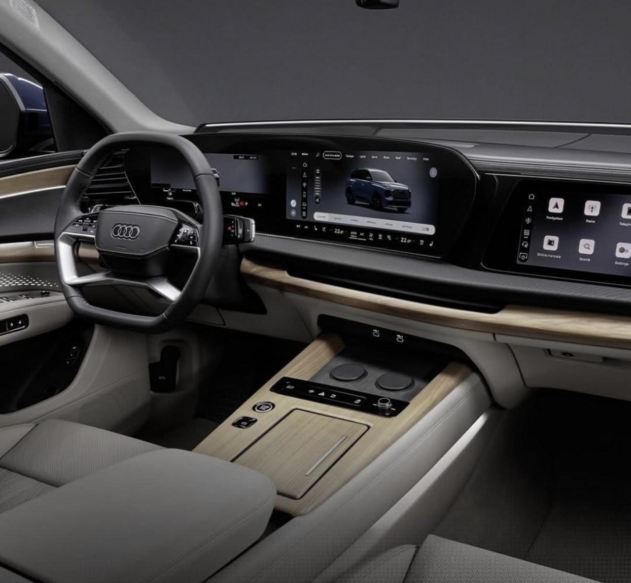 Yeni Audi Q7'nin üç ekranlı kokpiti ve ahşap detaylarla zenginleştirilen kabini, markanın modern tasarım anlayışını yansıtıyor.