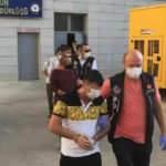 Gözaltına alındı, yüzünü maskeyle gizledi