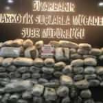 Çekiciyle taşınan iş makinesinde 159 kilo esrar ele geçirildi