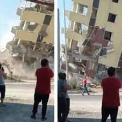 Hatay'da ağır hasarlı bina trafiğe açık yola devrildi