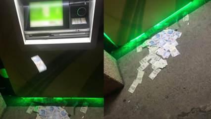 ATM'ye yüklenen fazla para sokağa saçıldı