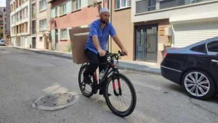 Bisikletiyle kapı kapı gezen imam, ihtiyaç sahiplerini sevindiriyor
