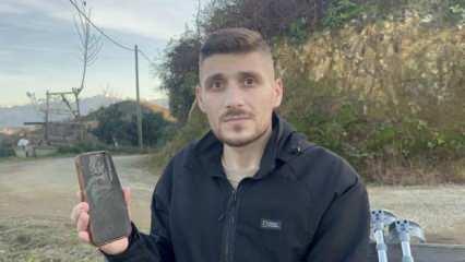 Cebindeki telefon sayesinde kurtuldu