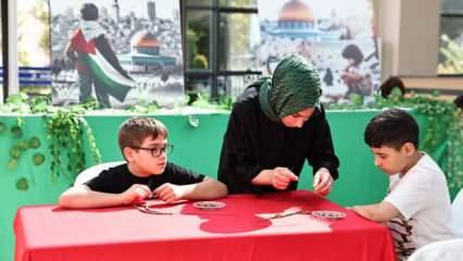 Gazze’deki zeytin ağacı katliamını zeytin çekirdeğinden tespih yaparak protesto ettiler