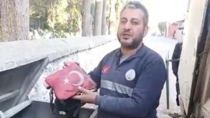 Temizlik işçisinden yürekleri ısıtan hareket! Yanmak üzere olan bayrağı çöpten aldı