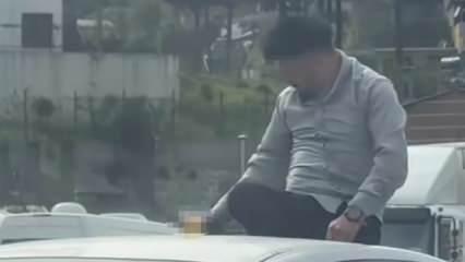 Canını hiçe saydı! Otomobilin üzerinde alkol tüketen şahsın pes dedirten keyfi