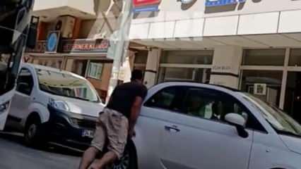İzmir'de bir kişi otomobili tek başına kaldırarak yolu açtı: Hulk musun sen?