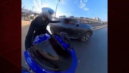 Marifetmiş gibi kayda aldı: Yumrukla sürücüyü yere serdi