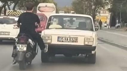 Trafikte inanılmaz olay! Tek ayağıyla sürücüyü kurtardı
