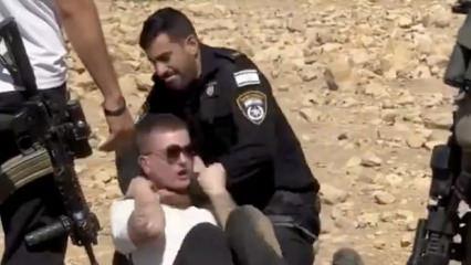 İsrail polisi, Filistin'de toprak gasbına karşı çıkan İsrailli aktivisti dövdü