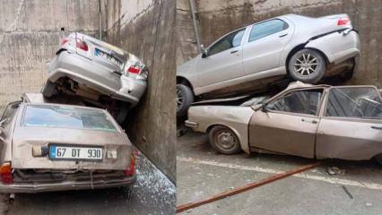 Rampadan geri kayıp 8 metrelik duvardan d&uuml;şt&uuml;: Park halindeki aracın &uuml;zerine &ccedil;ıktı