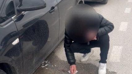 Yere attığı izmaritleri zabıtayı g&ouml;r&uuml;nce tek tek topladı