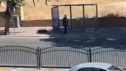 Durakta bekleyen eşini silahla vurdu