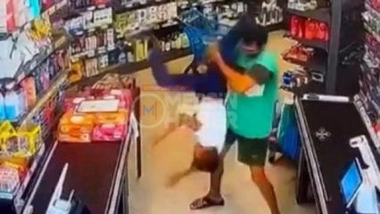 Markette kan donduran anlar: G&ouml;z&uuml; d&ouml;nm&uuml;ş cani &ccedil;ocuğu defalarca yere fırlattı