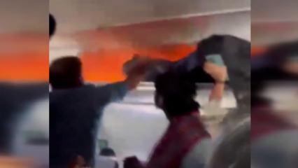 Hindistan'da yolcu u&ccedil;ağında yangın paniği! U&ccedil;ak acil iniş yaptı