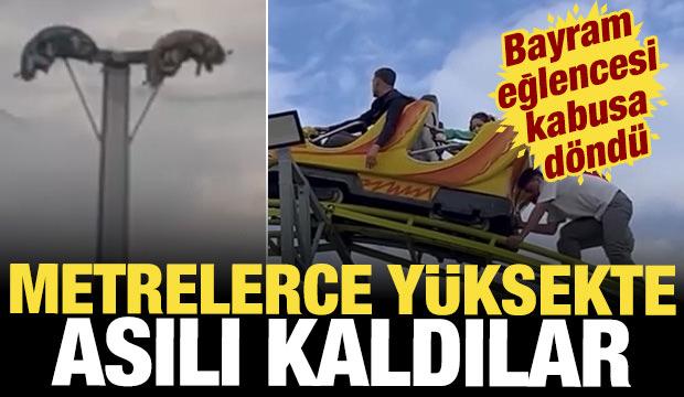 Bayram eğlencesi kabusa d&ouml;nd&uuml;: Metrelerce y&uuml;ksekte baş aşağı asılı kaldılar