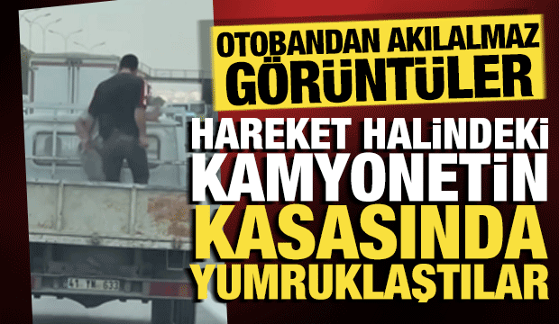 Otobandan akılalmaz g&ouml;r&uuml;nt&uuml;ler: Hareket halindeki kamyonet kasasında yumruklu kavga!