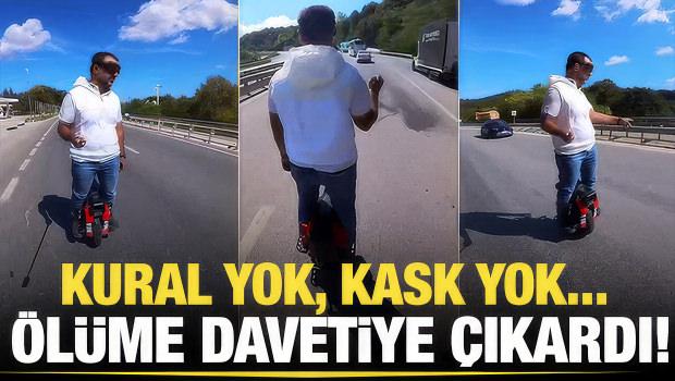 Trafikte akılalmaz anlar: Tek tekerlekli scooter ile tırların sağından ge&ccedil;ti